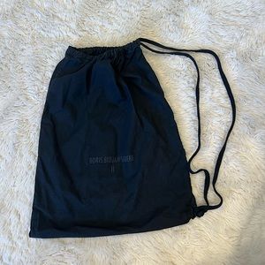 11 by Boris Bidjan Saberi Black drawstring knit logo rucksack bag